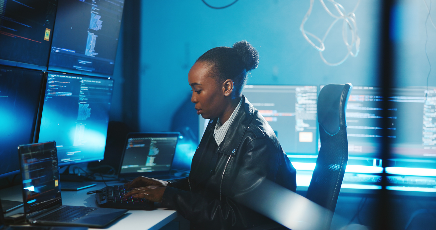 A Cybercrime Investigator Works in an Office at Night..jpg