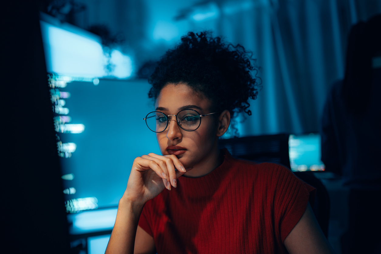 A Cybersecurity Professional Focusing on Monitors..jpg